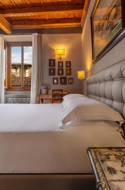 Restored stone farmhouse villa surrounded by lush Chianti vineyards